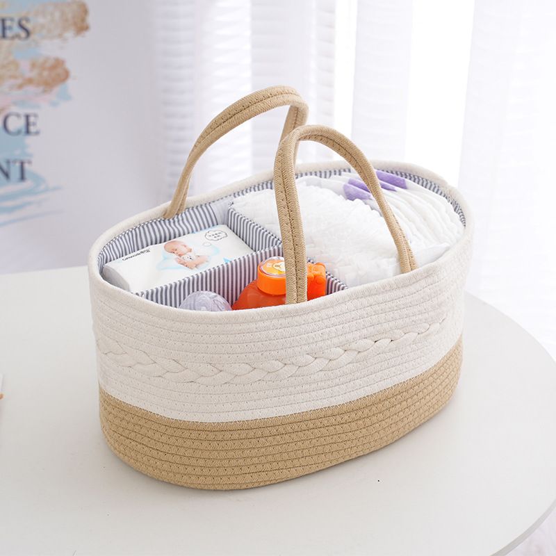 Beige color Nursery Storage Basket  filled with baby accessories kept on top of a table 