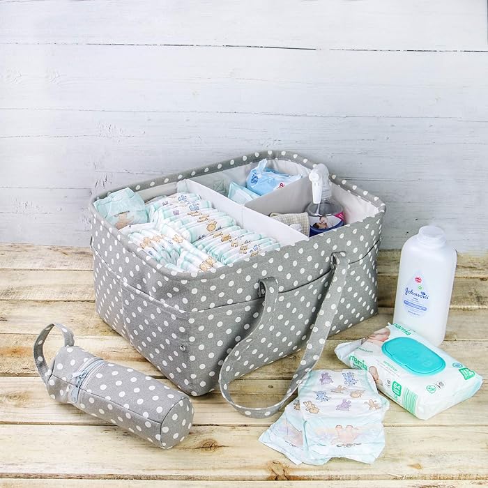 Baby Diaper Caddy Bag and bottle carrier kept on a wooden surface along with baby wipe,diapers and baby powder