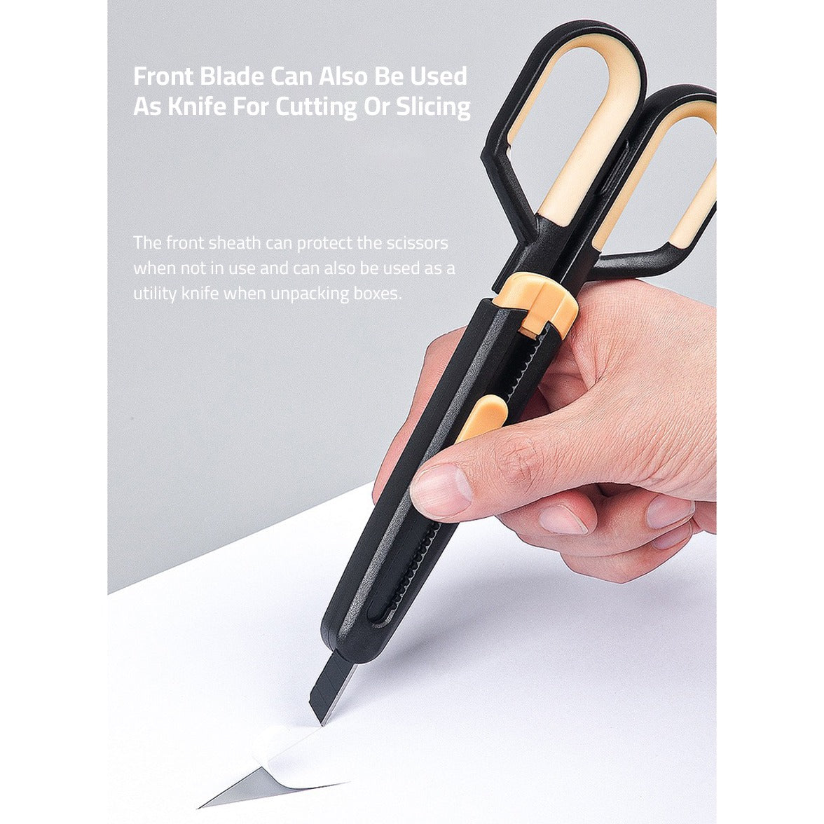 A paper being teared by a person with Scissors using it's Paper Cutting Blade