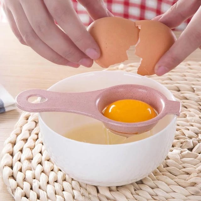 A person separating egg yolk to a bowl using Egg Separator Tool