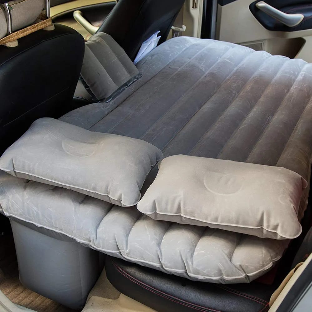 Grey color Inflatable Car Bed with pillow arranged in a car ready for use