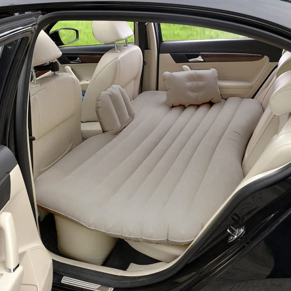 Beige color Inflatable Car Bed with pillows arranged in a car ready for use