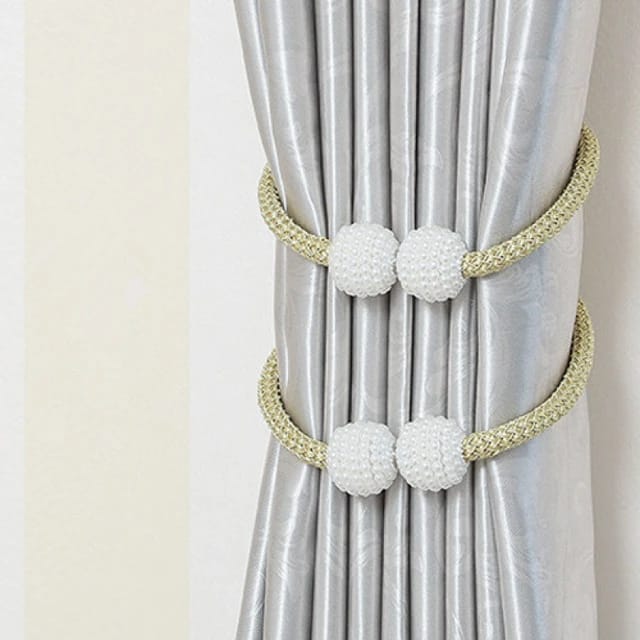 A curtain tied using 2 Magnetic Curtain Binding Rope
