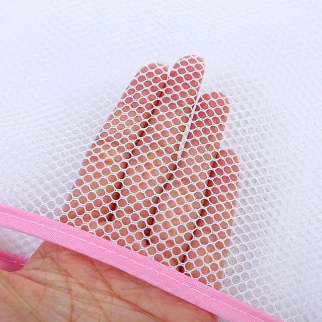 Image dispaying,a person holding the Toy and Pillow Drying Net 