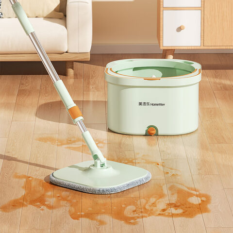 A Coffee spilled floor being cleaned with the use of Spin Mop and Bucket