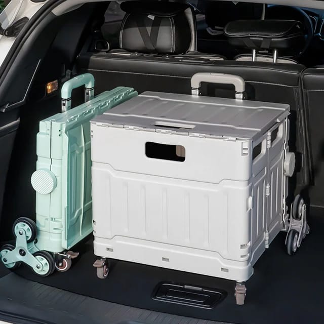 Two Folding Shopping Carts placed inside a car boots pace, one folded while the other one is collapsed 