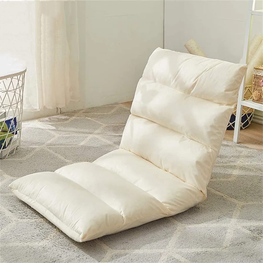 Beige color Lazy Lounge Sofa Bed placed next to a tea table in a room 