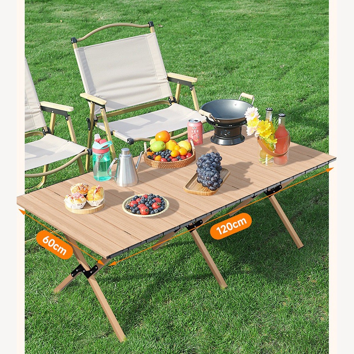 Image displaying and mentioning the size of Outdoor Portable Camping Table being used on a picnic and some fruits,snacks,gas stove and other picnic essentials placed on top of it