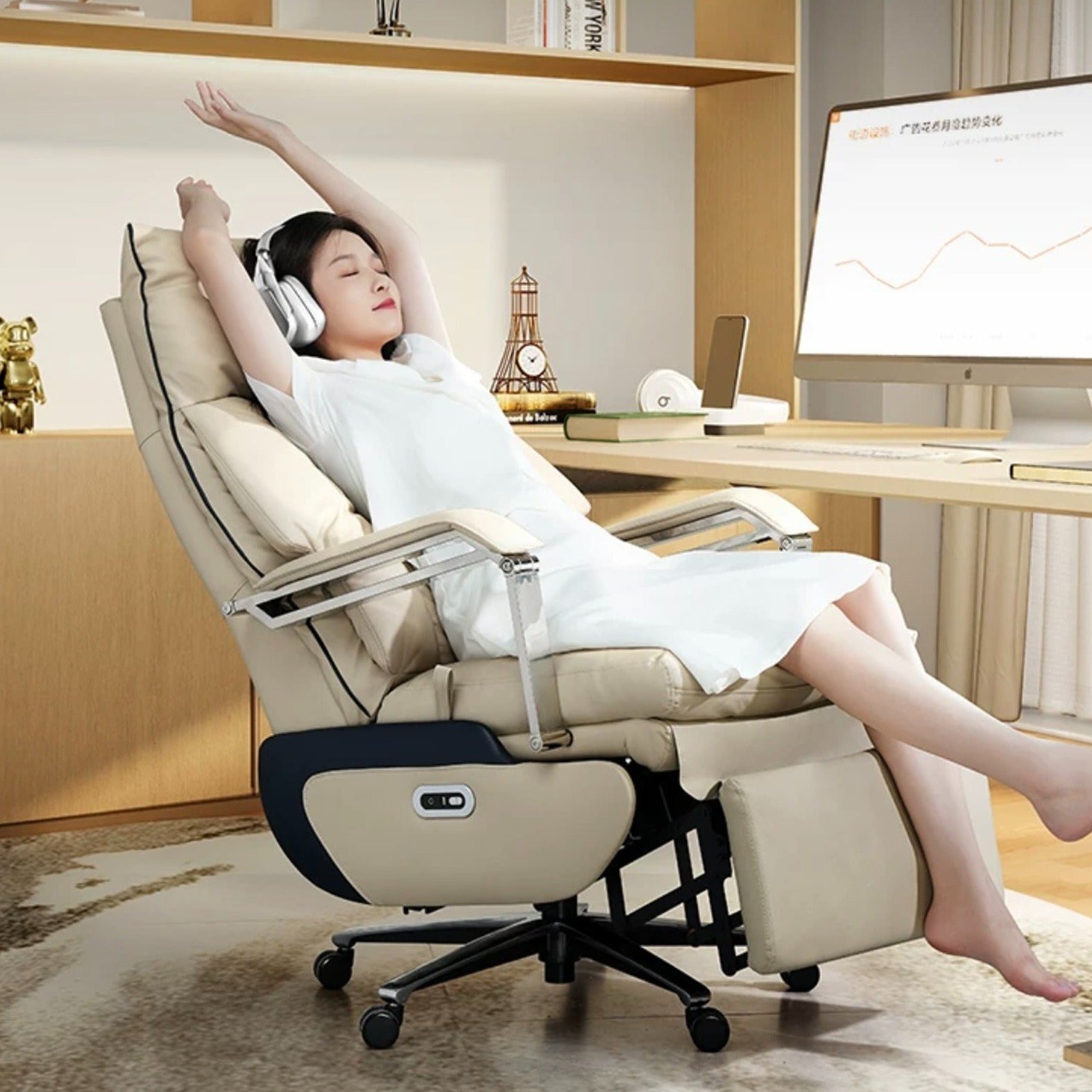 A person relaxing on an Adjustable Electric Office Chair situated in front of a PC and listening to music