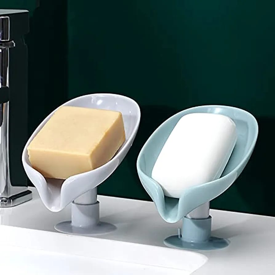 Two Leaf Shaped Soap Holders with soap kept on those placed in a wash basin 