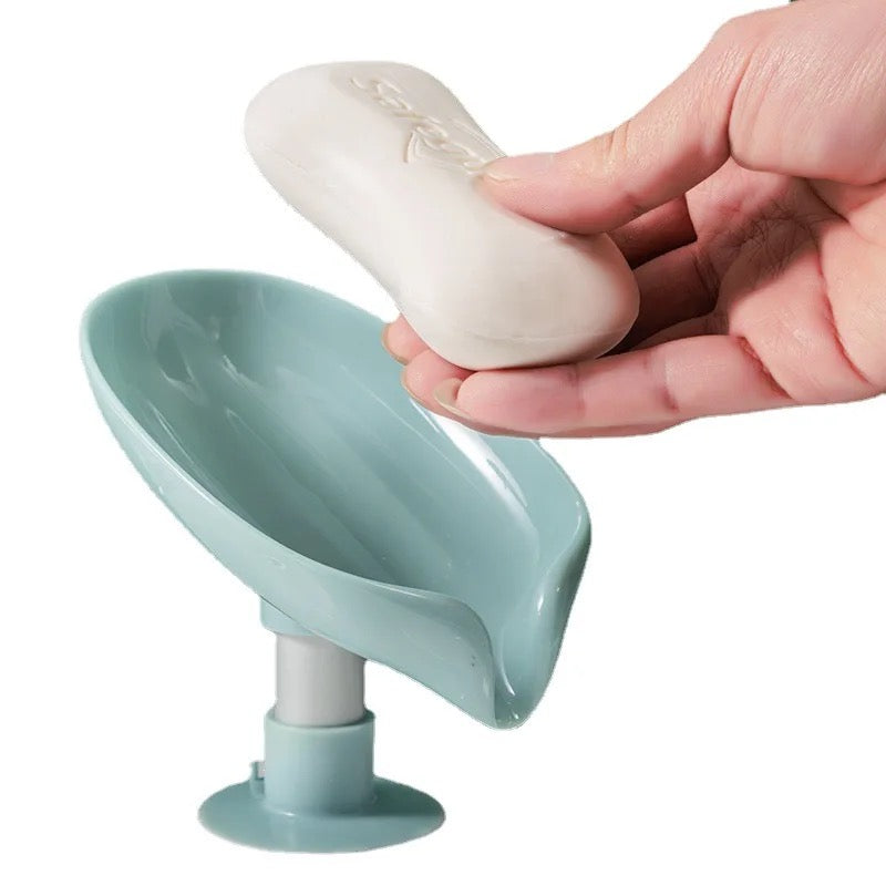 A person keeping a soap on a Leaf Shaped Soap Holder