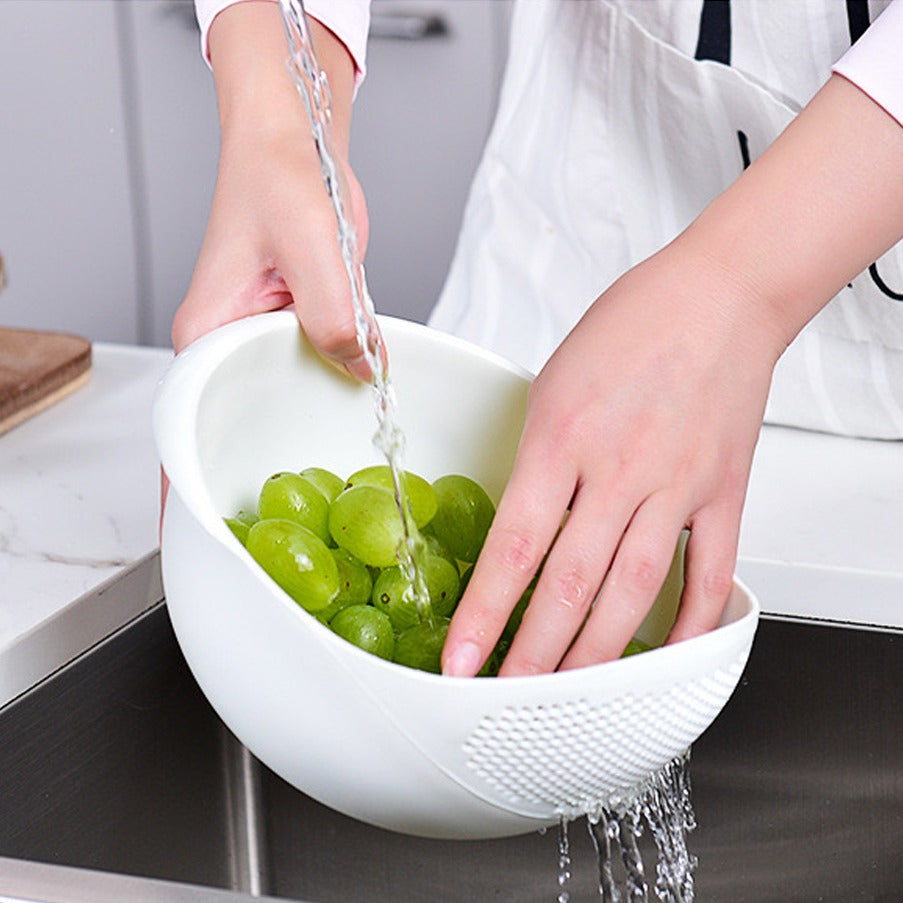 A person washing Green Grapes with the help of Plastic Fruit Washing Strainer Basket