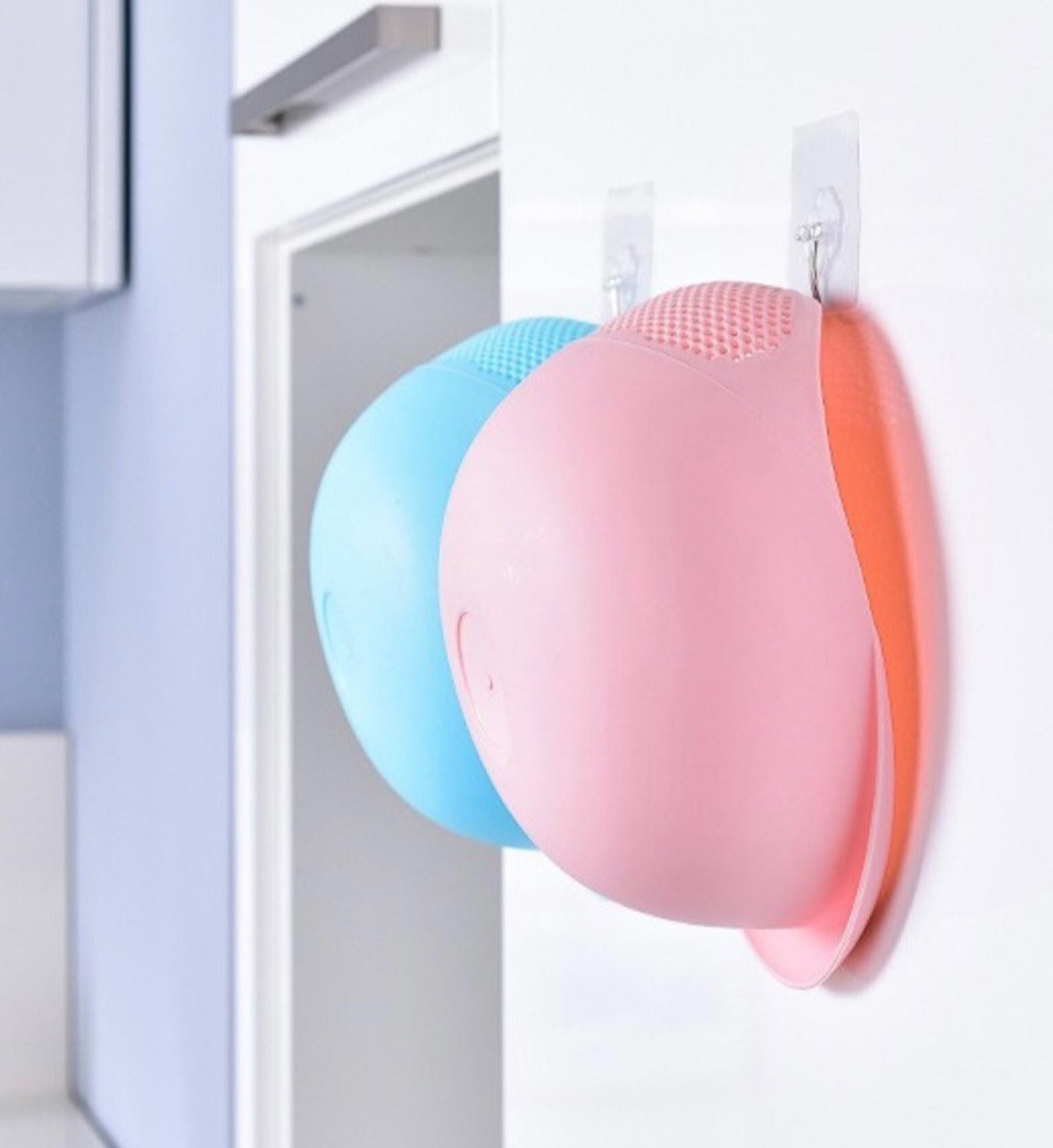Two Plastic Rice Washing Strainer Baskets hung on a wall mount 