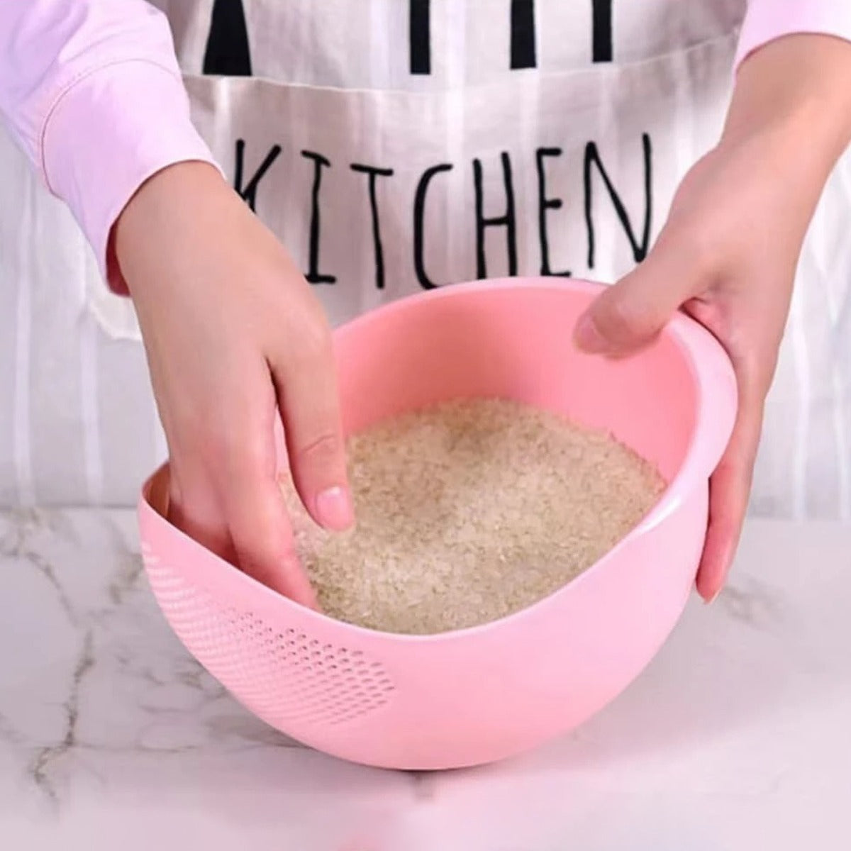 A person stirring Rice stored in a Plastic Rice Washing Strainer Basket