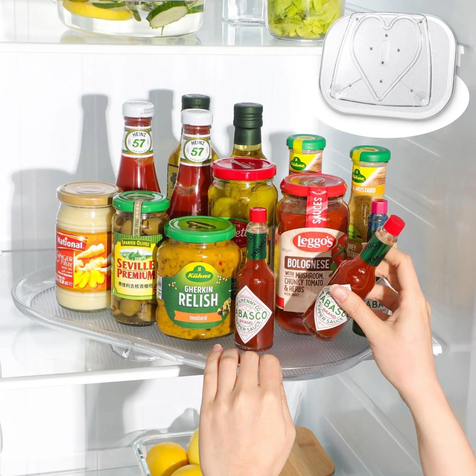 A person storing sauces and pickles on 360° Rotating Fridge Tray and keeping it into a fridge 