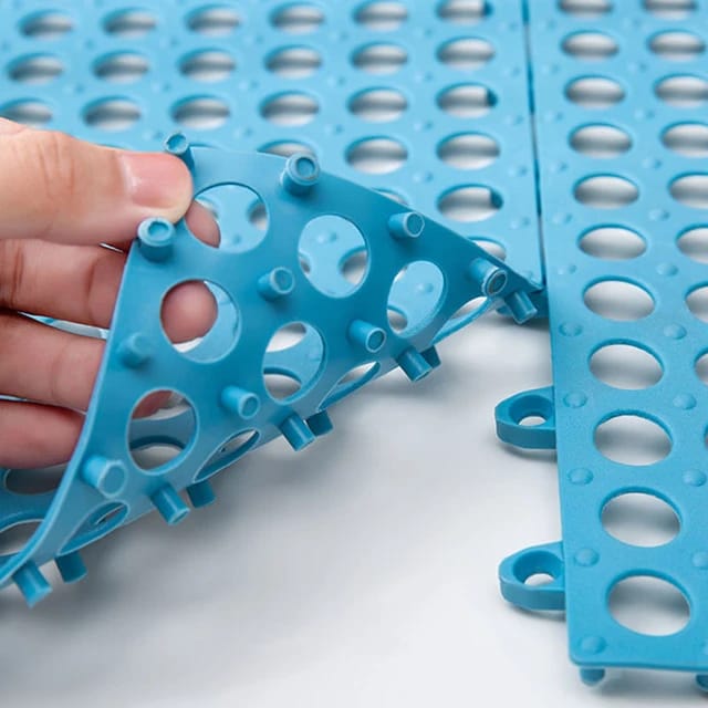 A person fitting Blue color Interlocking Non-Slip Bathroom Mat
