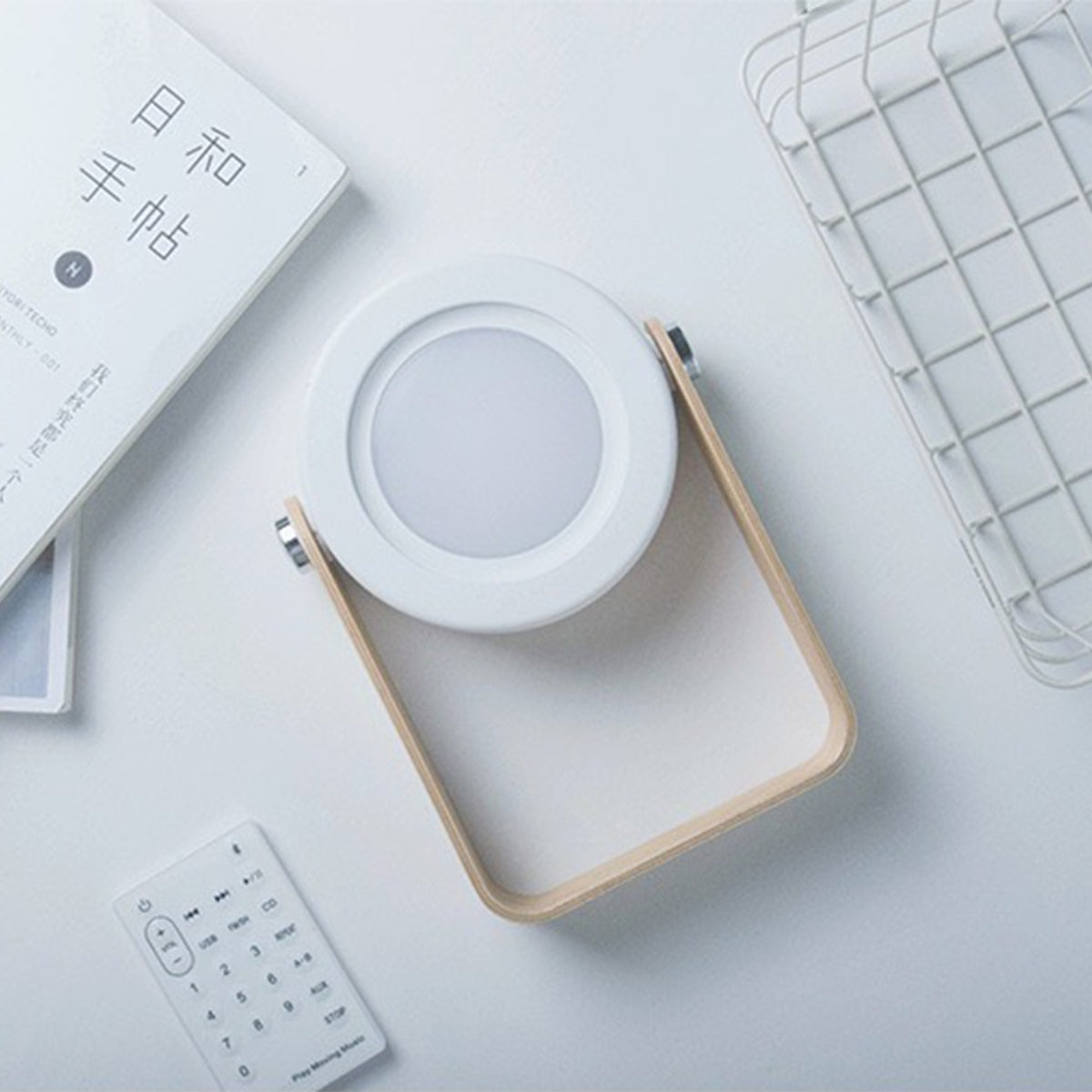 Retractable Table Lamp with USB Rechargeable on a table next to some items