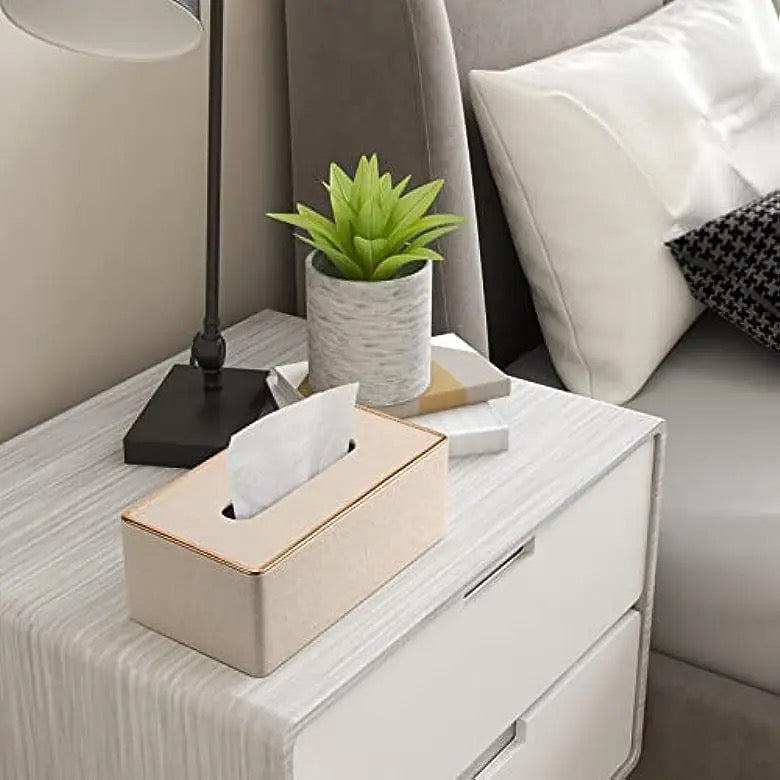 Rectangular Tissue Box Holder placed on the table next to a vase of flowers