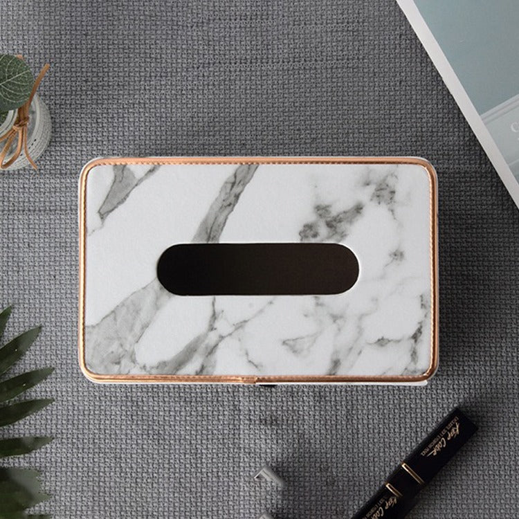 Rectangular Tissue Box Holder placed on the table next to various items