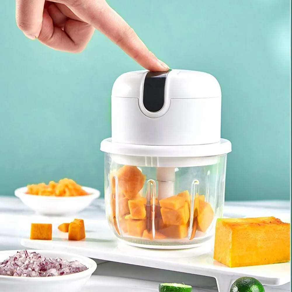 Someone pressing the switch of the Mini Electric Chopper Food Processor