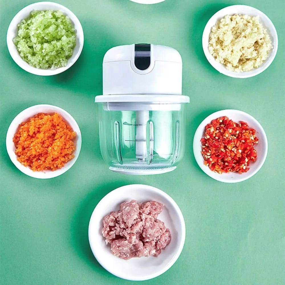Mini Electric Chopper Food Processor placed next to ingredients in bowls