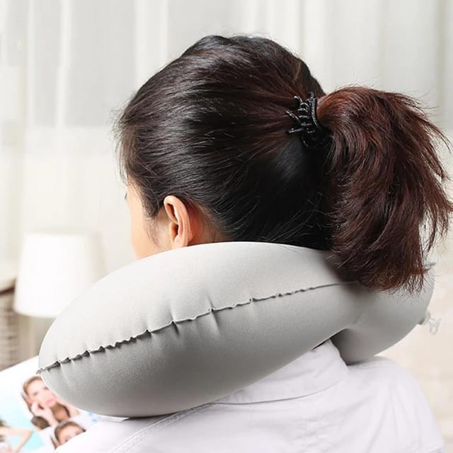 A girl wearing an Inflatable U-Shape Travel Neck Pillow