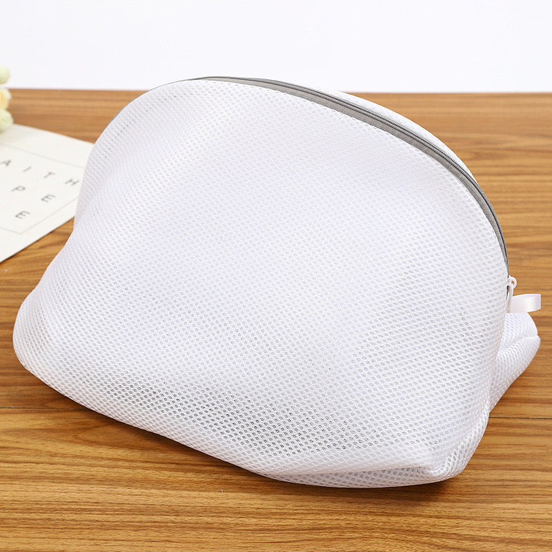 Reusable Shoes Sneakers Washing Mesh Laundry Bag with Zip Closure placed on the table