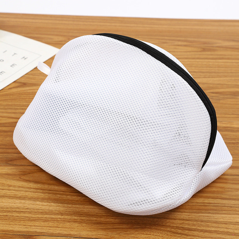 Reusable Shoes Sneakers Washing Mesh Laundry Bag with Zip Closure placed on the table