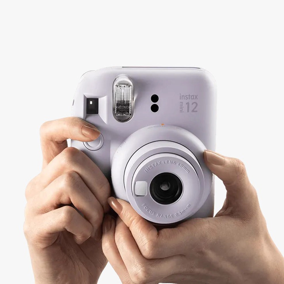 lady holding Fujifilm Instax Mini 12 Camera 