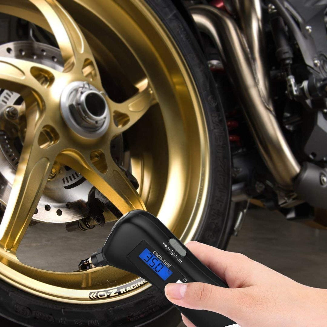 someone checking tire pressue with 9 in 1 Digital Tire Pressure Gauge
