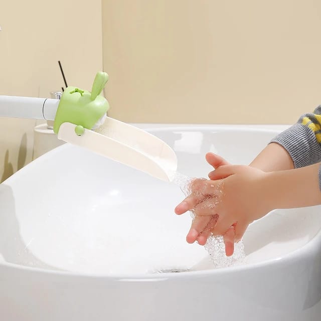 A Baby Is Washing Hands On Fauced Which is Connected with Faucet Extender for Toddlers.