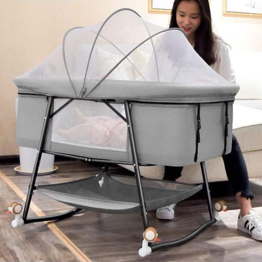 A Mother is Sitting Near Newborn Baby Cradle.