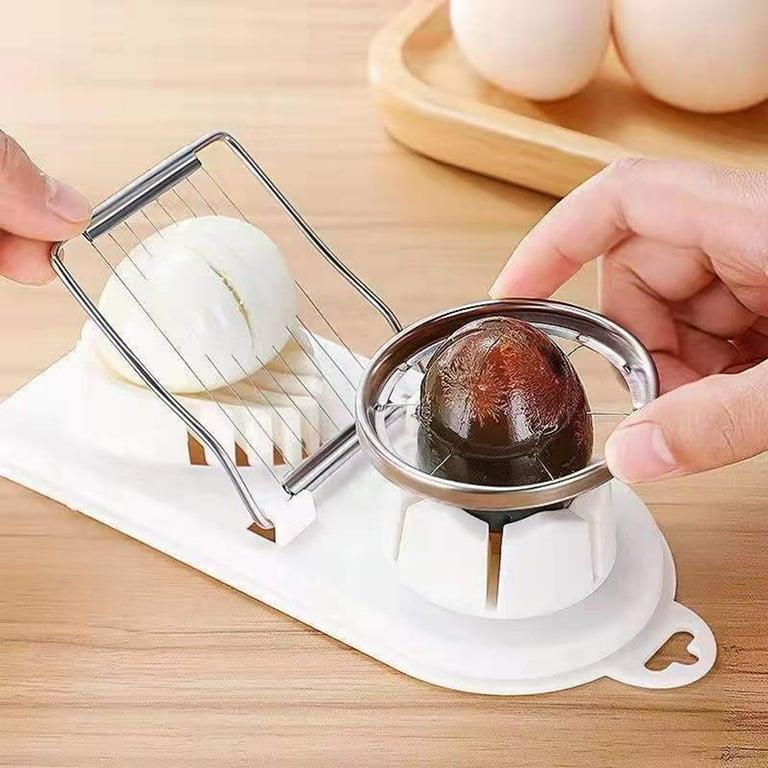 A Person is Slicing Egg Using Heavy Duty Manual Egg Slicer.