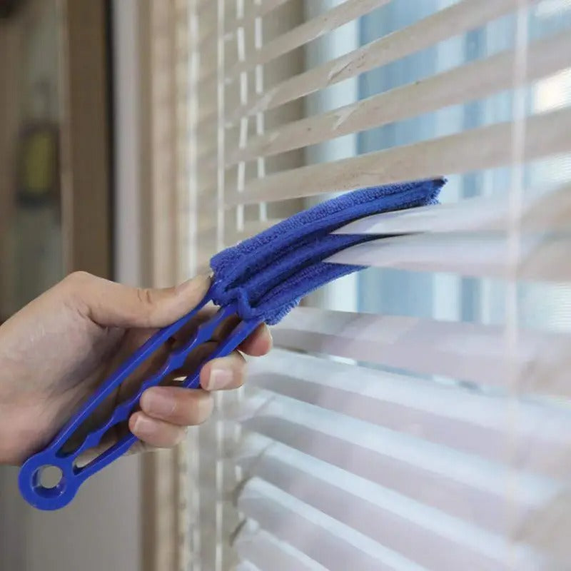 someone cleaning out with Window Blinds Cleaner Duster Brush