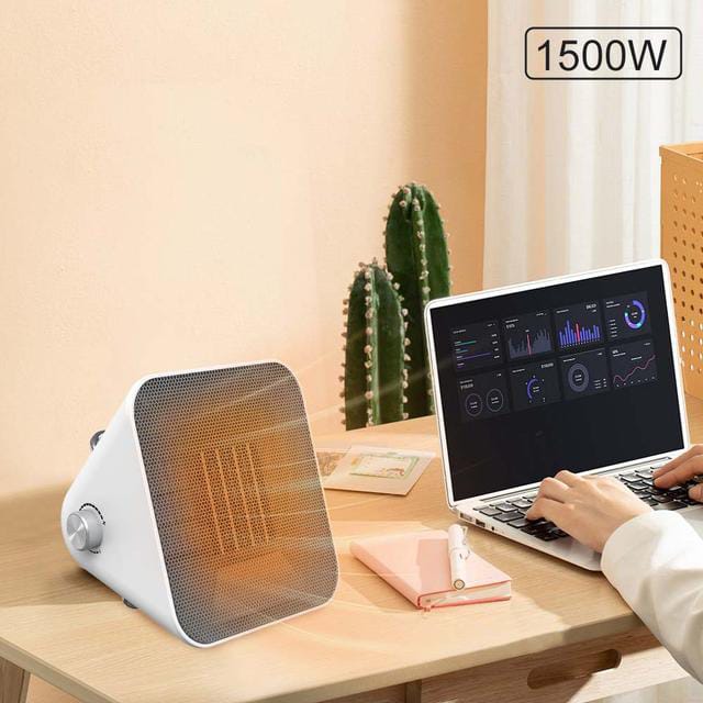 A Person is Working Infront Of Winning Star Portable Space Heater.