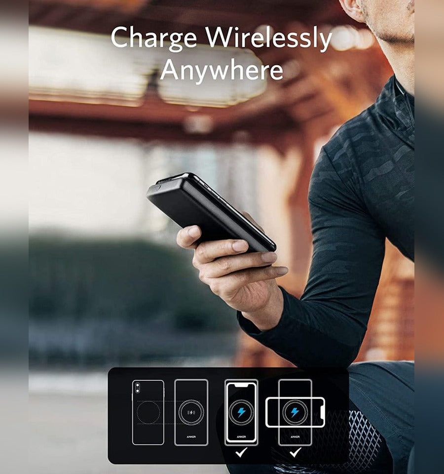 Someone is using his phone while charging it with the Anker 10W PowerCore III Sense 10K Wireless Power Bank