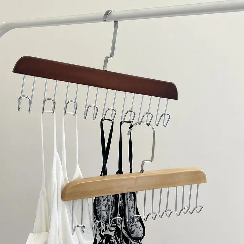 A rack with clothes hanging on 8 hooks non-slip hanger, perfect for organizing your wardrobe.