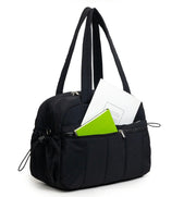 Women Travel Duffle Bag, Multi-Pocket Gym Bag Organized with Some Books.