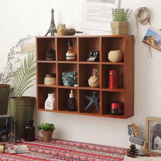 Wooden Wall Hanging Display Rack With Decors and Pots Are Diaplayed On it.