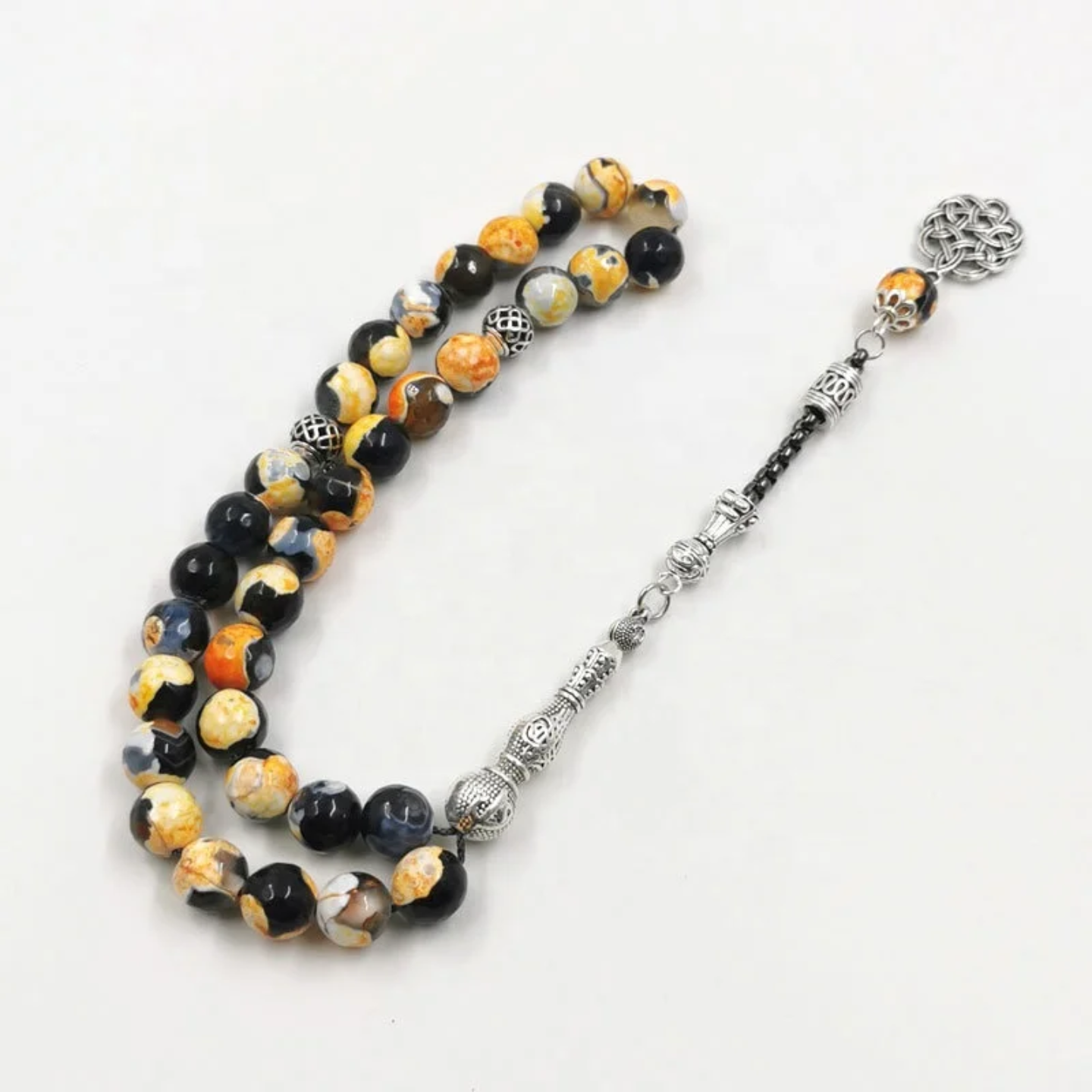 An Yellow Islamic Tasbih Prayer Beads.