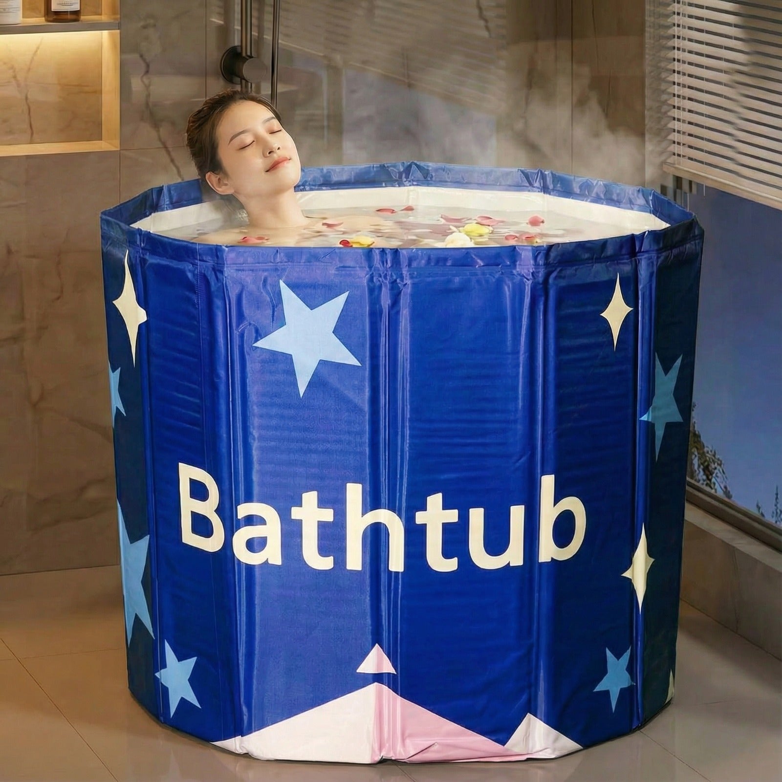 A woman is relaxing in a blue portable adult bathtub