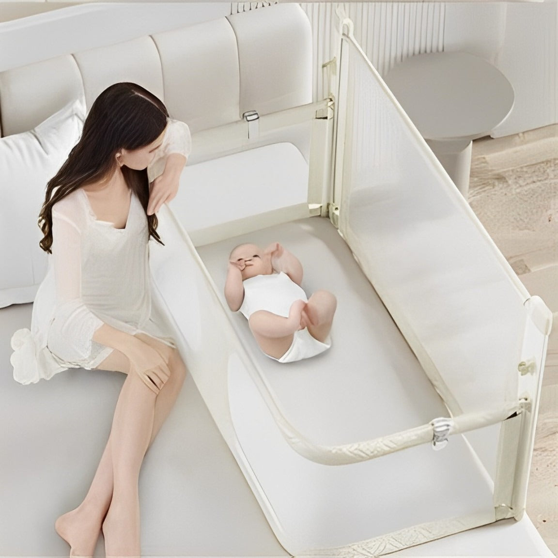 baby lying down on bed in Height Adjustable Baby Bed with mommy beside