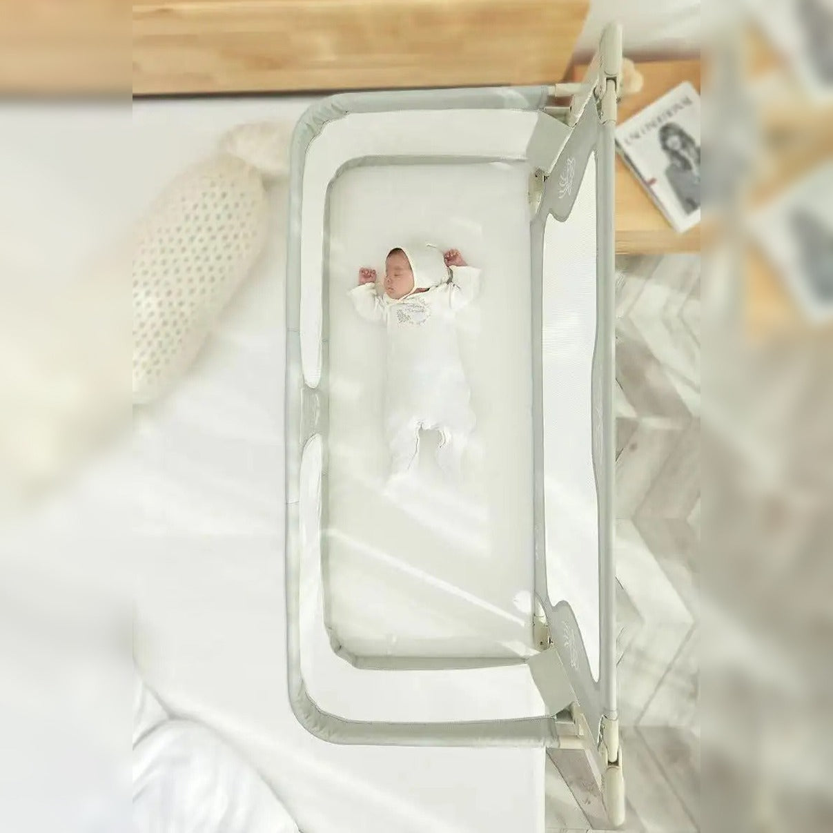 baby sleeping in Height Adjustable Baby Bed