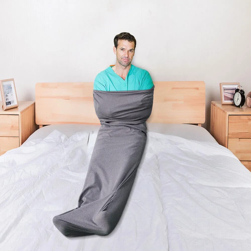 A Man in a Wearable Sleep Pod.