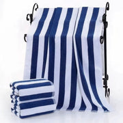 Blue and white striped beach towel on a white background