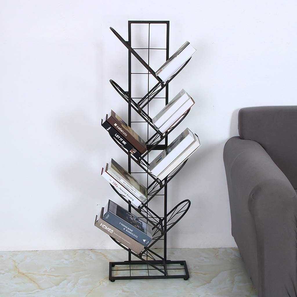 Black metal bookshelf with books against a white wall