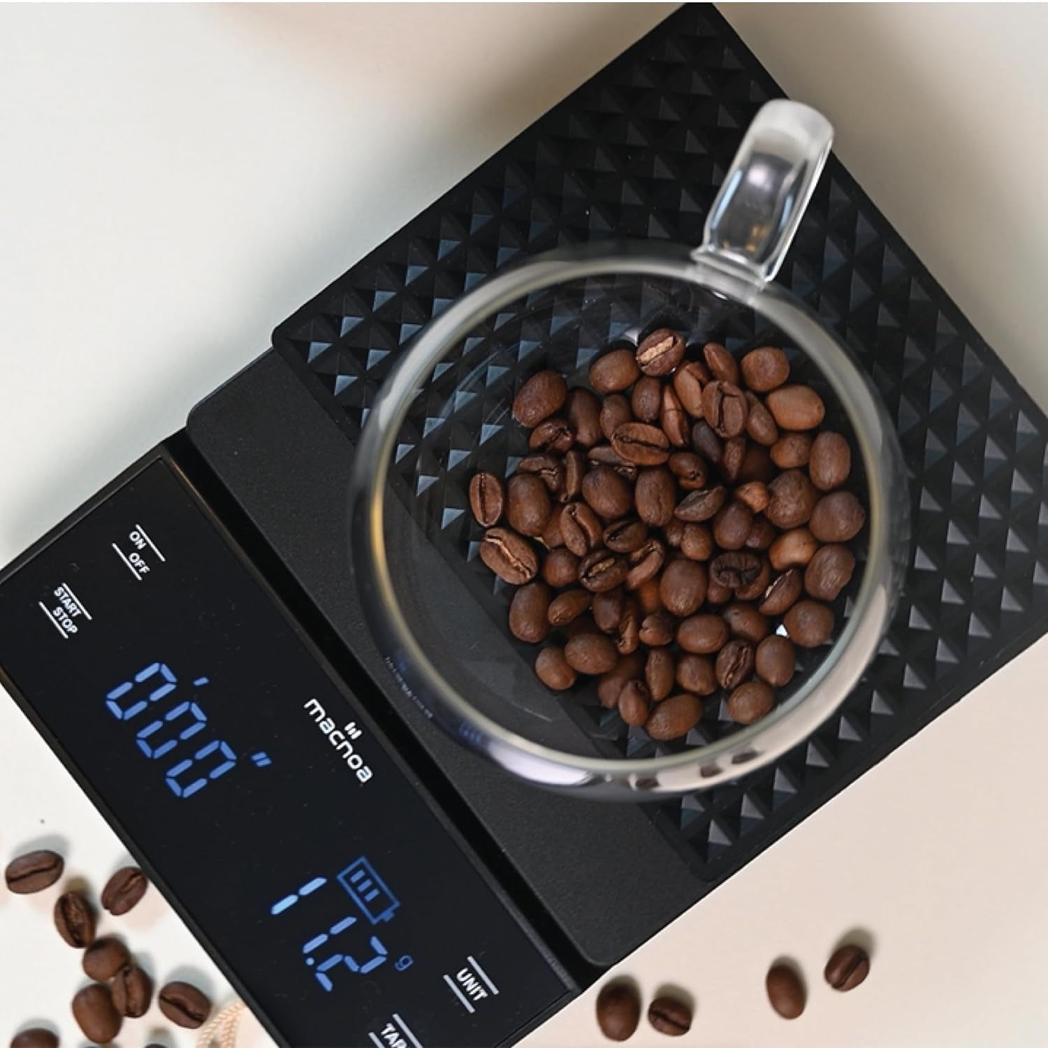coffee bean is measured in a cup in Macnoa Coffee Scale