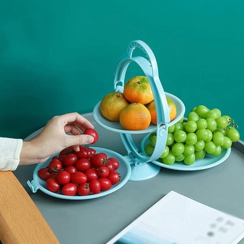 A person is taking fruits from a creative Folding Fruit Plate.