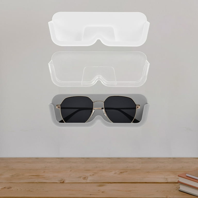 Wall Mounted Eye Glass Holder with Eye Glass in it.