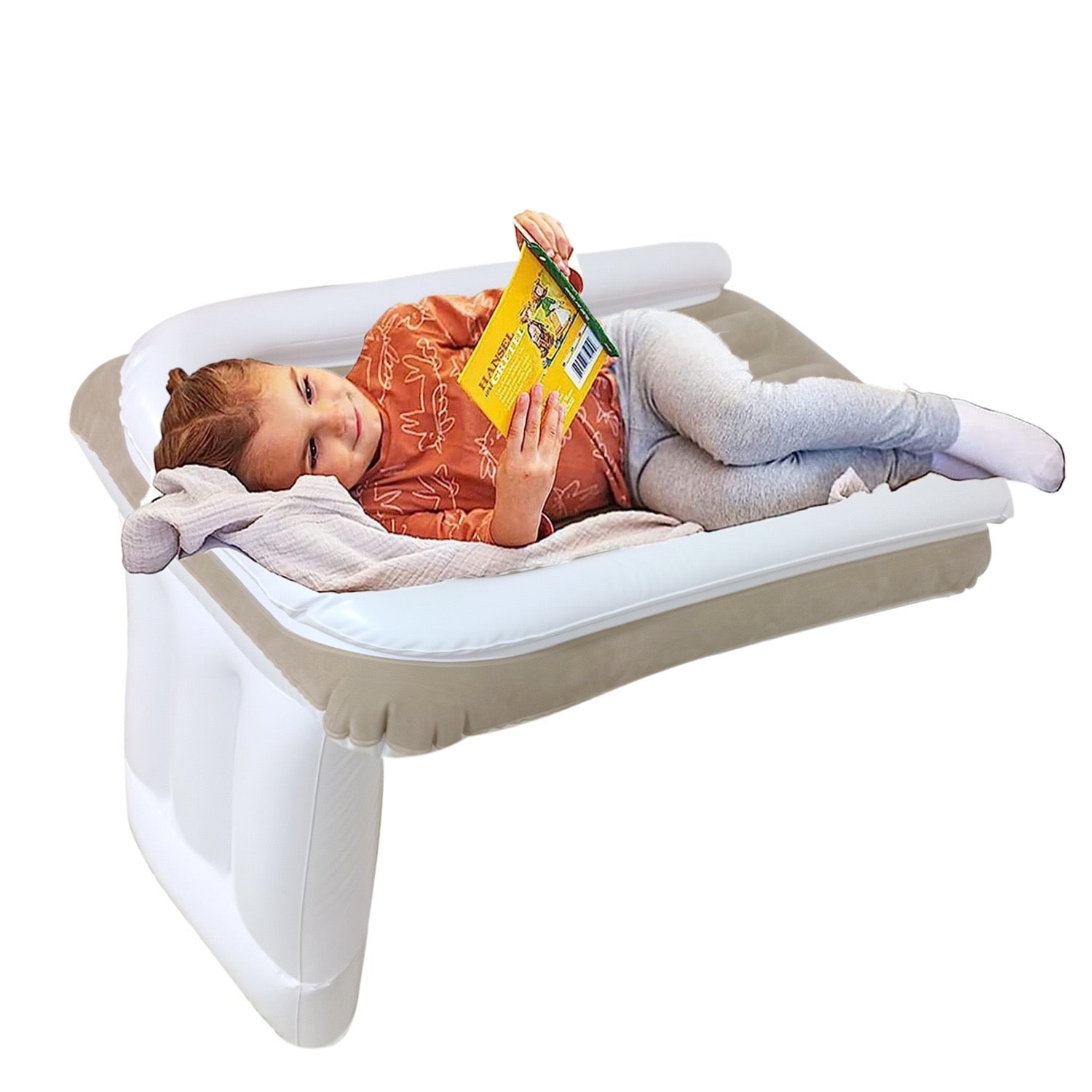 girl enjoying reading by lying in air bed